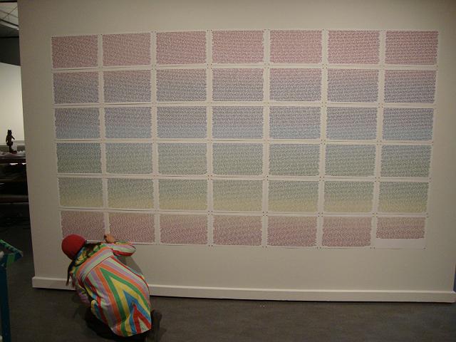 install - untitled (9).JPG - lara applying little paper dots to the magnets so they are hidden somewhat